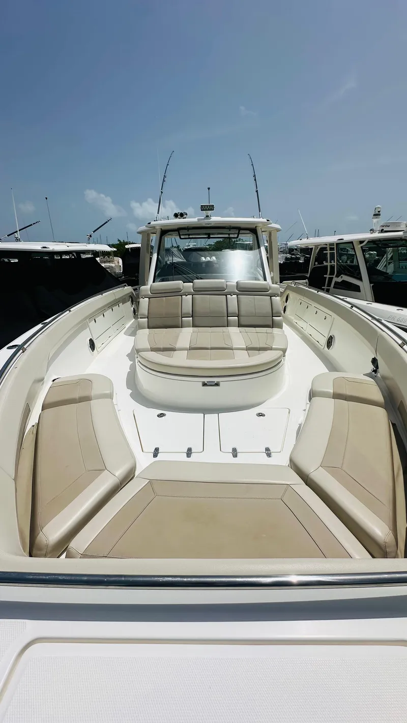 Slide: The Image of 2021 Boston Whaler 420 Outrage boat with spacious seating and sleek design. - 15