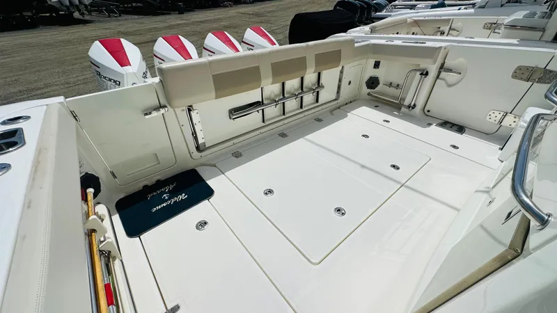 Slide: The Image of 2021 Boston Whaler 420 Outrage boat deck with multiple outboard engines. - 4