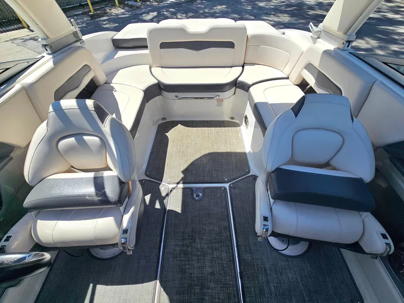 Slide: The Image of 2017 Chaparral 246 SSi boat interior with white seating and carpeted floor. - 18