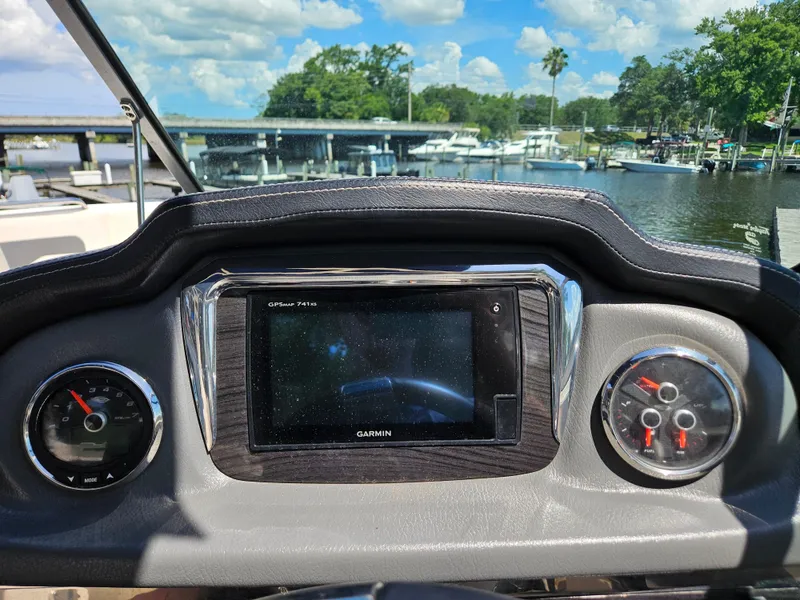 Slide: The Image of Dashboard of 2017 Chaparral 246 SSi boat with Garmin GPS and gauges, docked by marina. - 20