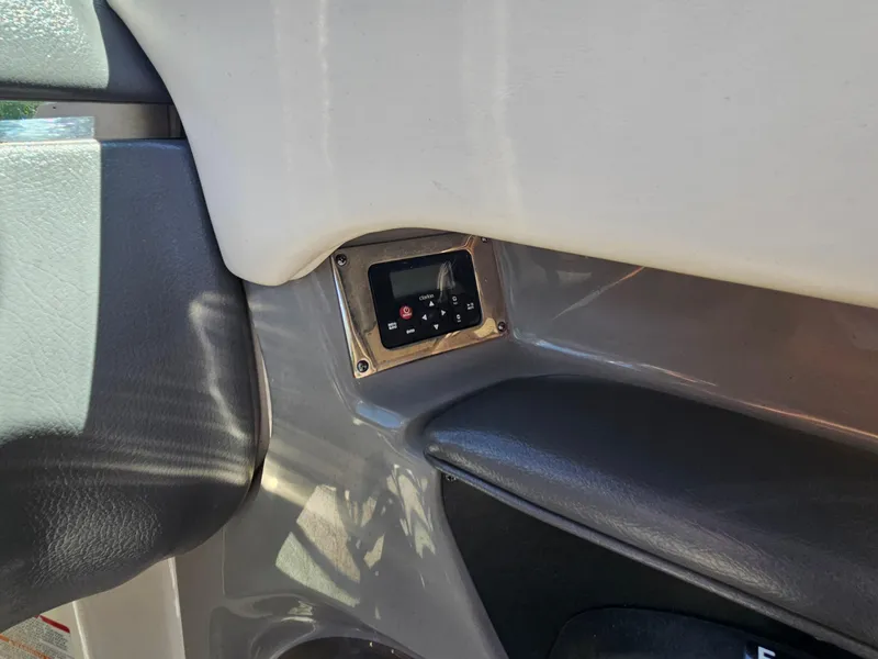 Slide: The Image of Control panel on 2017 Chaparral 246 SSi boat interior. - 23