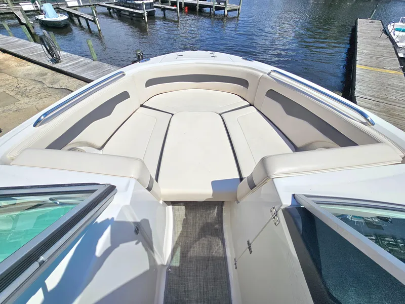 Slide: The Image of 2017 Chaparral 246 SSi boat interior with spacious seating and waterfront view. - 31