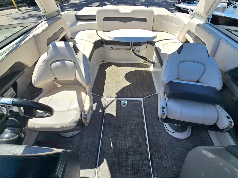 Slide: The Image of 2017 Chaparral 246 SSi boat interior with seating and table, featuring modern design. - 35