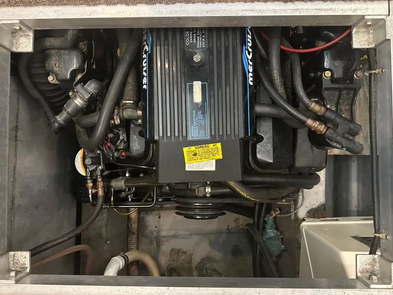 Slide: The Image of 1993 Carver 350 Aft Cabin engine compartment with MerCruiser engine components. - 22