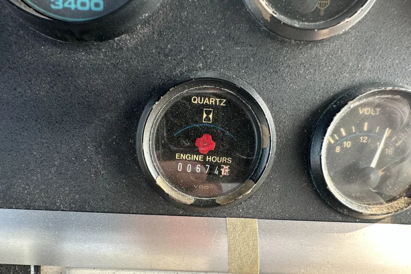 Slide: The Image of 1993 Carver 350 Aft Cabin engine hour meter showing 674.5 hours. - 4