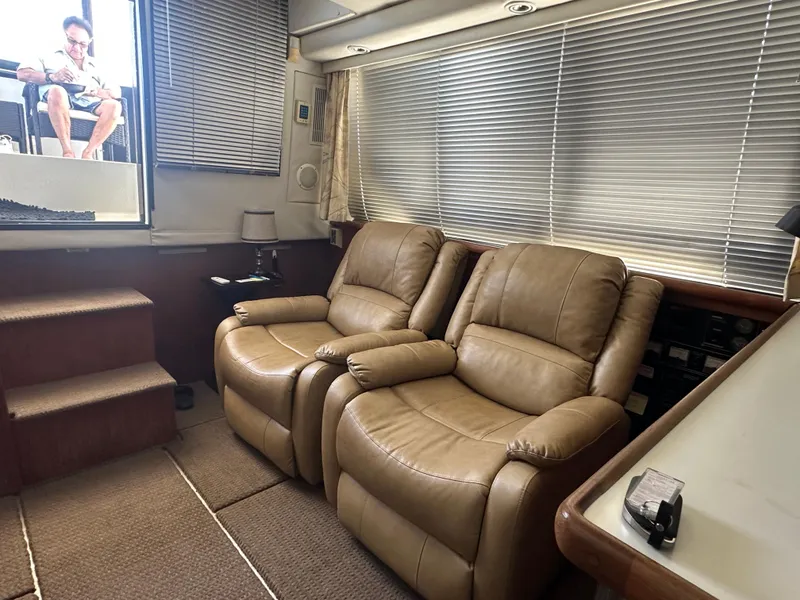 Slide: The Image of Interior of 1993 Carver 350 Aft Cabin with leather recliners and window blinds. - 10