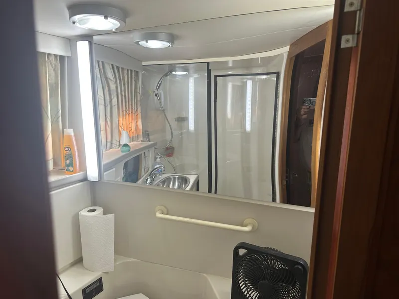 Slide: The Image of Bathroom interior of 1993 Carver 350 Aft Cabin with shower and sink. - 17