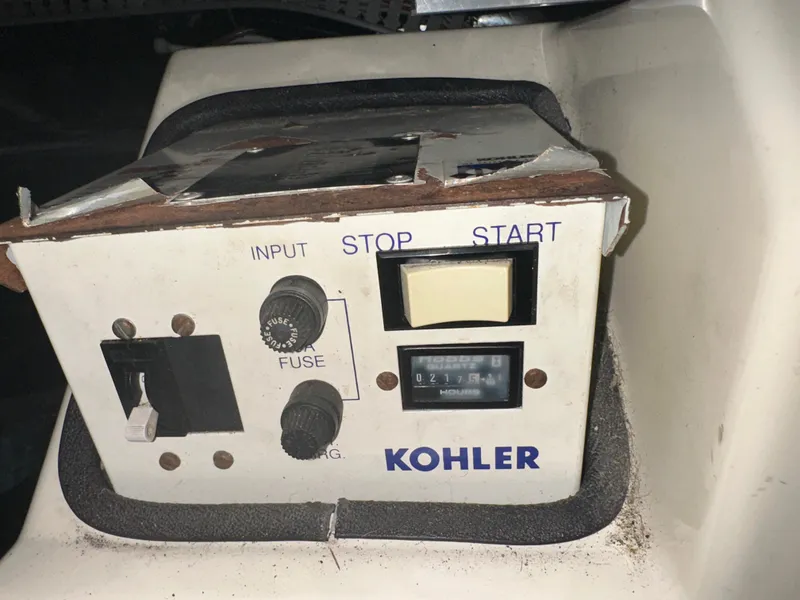 Slide: The Image of Control panel of a Kohler generator on a 1993 Carver 350 Aft Cabin boat. - 27