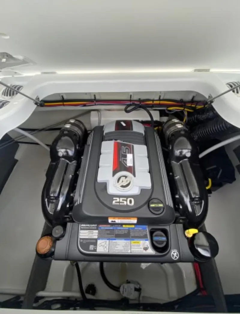 Slide: The Image of 2025 Four Winns H2 Freedom engine compartment with 250 horsepower motor. - 11