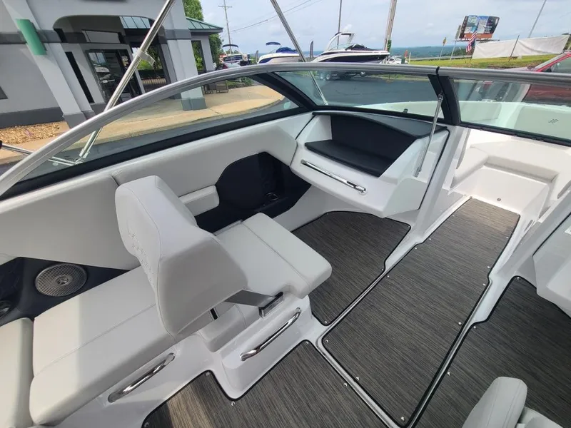 Slide: The Image of Interior of 2025 Four Winns H2 Freedom boat with sleek seating and modern design. - 7