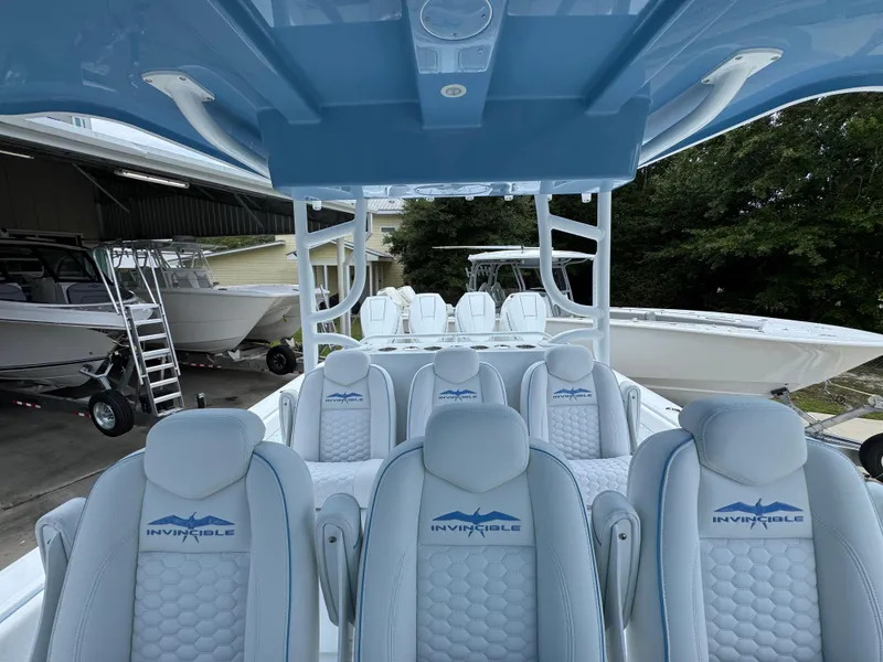 Slide: The Image of 2026 Invincible 43 Open Fisherman boat interior with luxurious seating and sleek design. - 24
