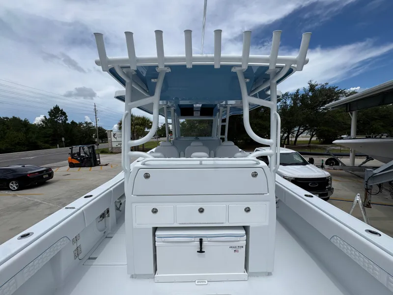 Slide: The Image of 2026 Invincible 43 Open Fisherman boat with spacious deck and storage, parked outdoors. - 33