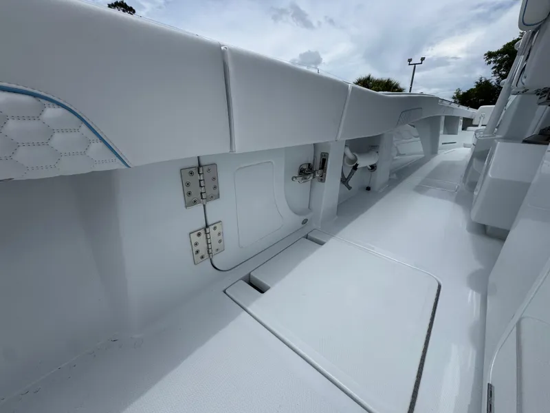 Slide: The Image of 2026 Invincible 43 Open Fisherman boat interior, showcasing sleek white design and modern fittings. - 34