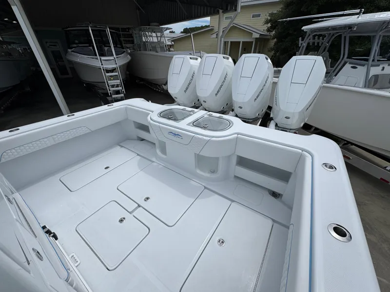 Slide: The Image of 2026 Invincible 43 Open Fisherman boat with four powerful outboard engines. - 35