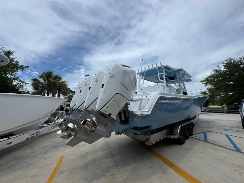 Slide: The Image of 2026 Invincible 43 Open Fisherman boat with multiple engines on a trailer. - 9