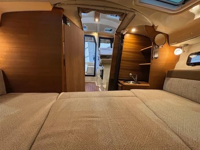 Slide: The Image of Interior of 2025 Ranger Tugs R-23 boat, featuring cozy cabin and modern amenities. - 5