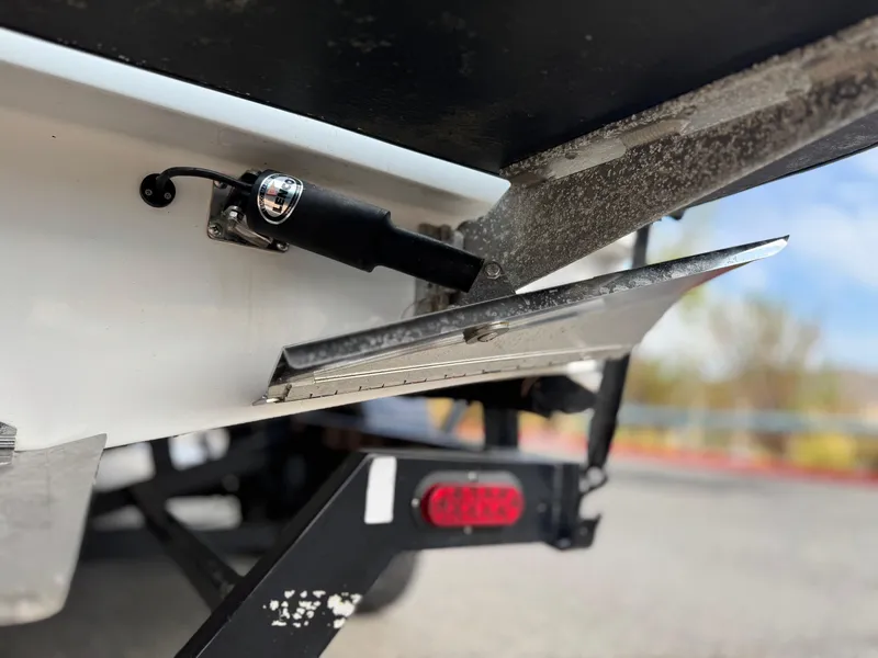 Slide: The Image of 2019 Tigé R21 boat trim tab and actuator close-up. - 10