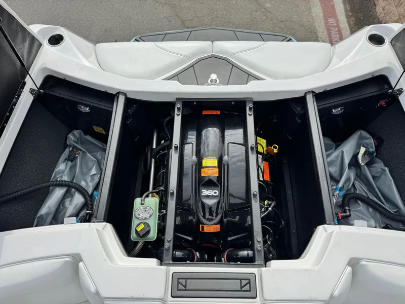 Slide: The Image of Engine compartment of a 2019 Tigé R21 boat, showcasing the 360 engine. - 23