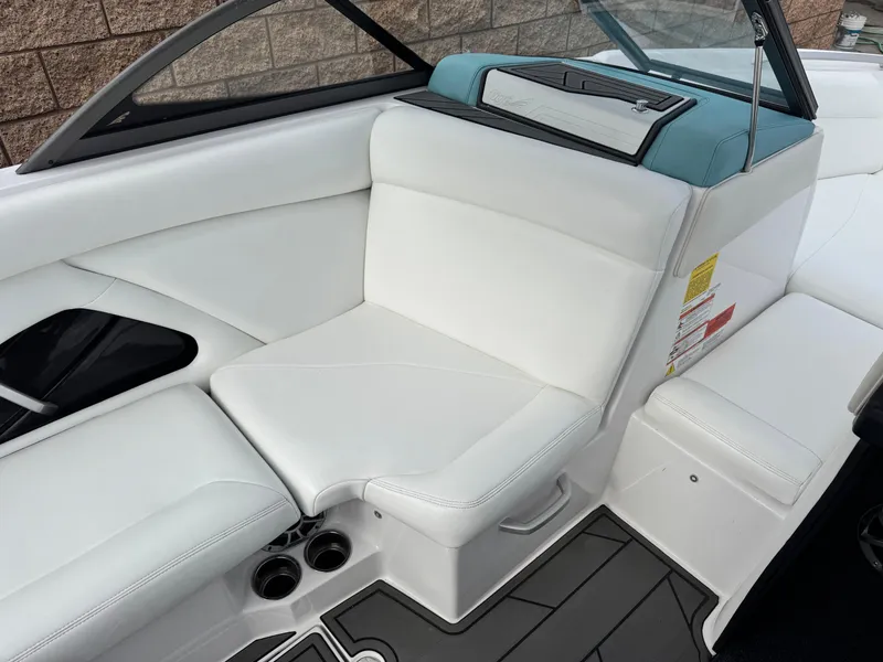 Slide: The Image of 2019 Tigé R21 boat interior with white seating and modern design. - 26