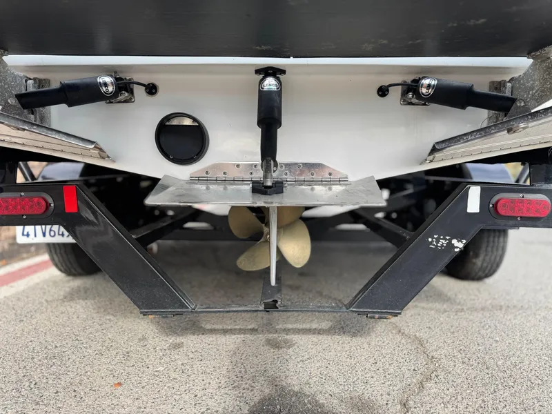 Slide: The Image of 2019 Tigé R21 boat underside showing propeller and trailer details. - 9