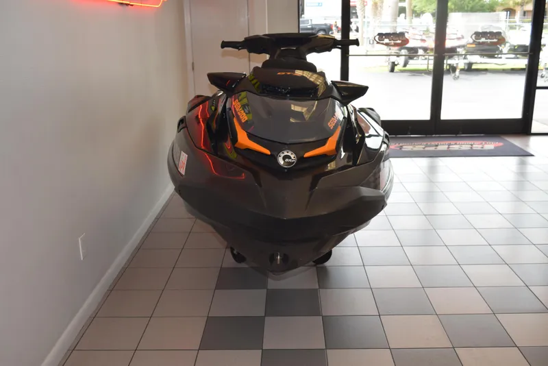 Slide: The Image of 2021 Sea-Doo GTX 170 jet ski displayed indoors on tiled floor. - 3