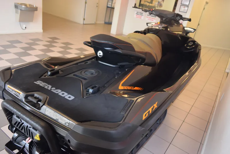 Slide: The Image of 2021 Sea-Doo GTX 170 jet ski displayed indoors on tiled floor. - 6