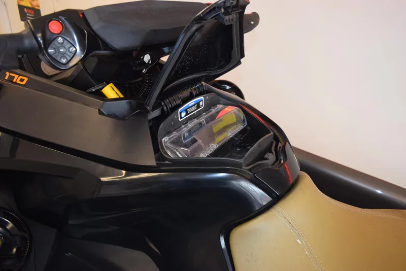 Slide: The Image of 2021 Sea-Doo GTX 170 storage compartment open, showcasing interior features and controls. - 9