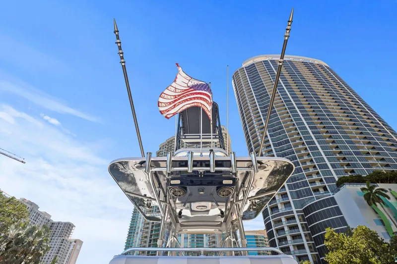 Slide: The Image of 2013 Invincible 42 Open Fisherman with American flag, city skyscrapers in background. - 17