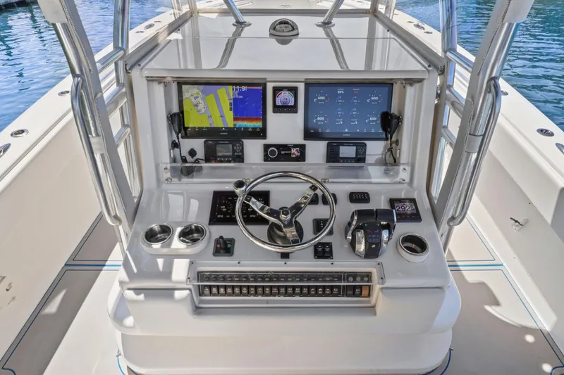 Slide: The Image of 2013 Invincible 42 Open Fisherman boat console with advanced navigation and control systems. - 22