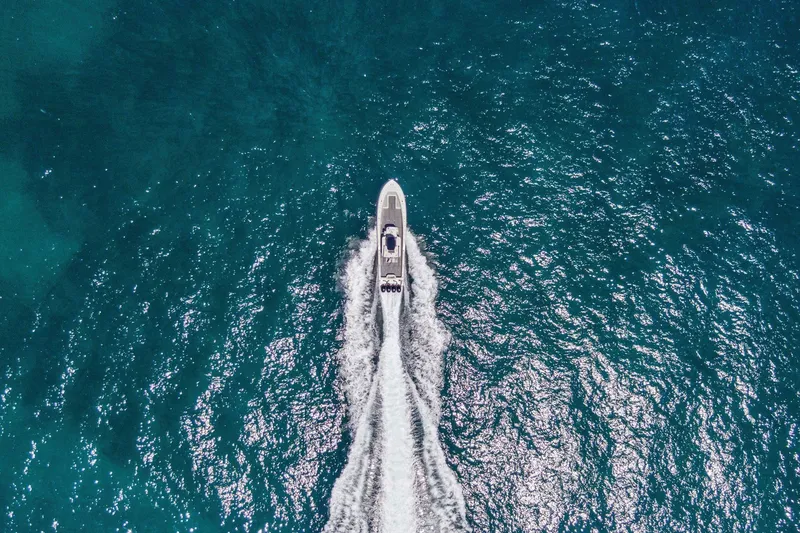 Slide: The Image of Aerial view of 2013 Invincible 42 Open Fisherman boat cruising on blue ocean waters. - 8