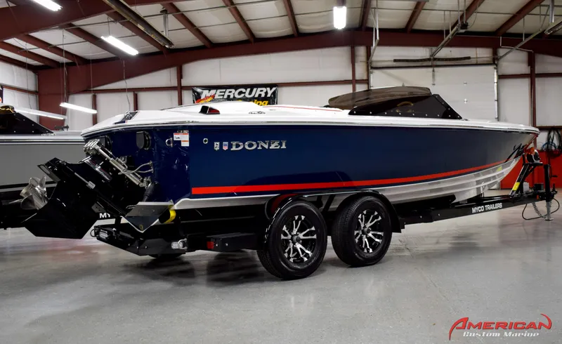 Slide: The Image of 2022 Donzi 22 Classic boat on trailer in indoor showroom. - 8