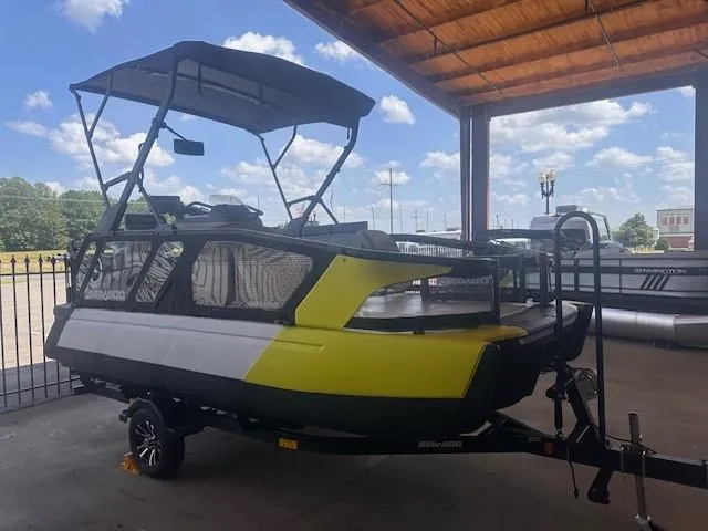 The Image of 2023 Sea-Doo Sport Boats 18 Switch Sport under a canopy, showcasing sleek design and vibrant colors. - 0