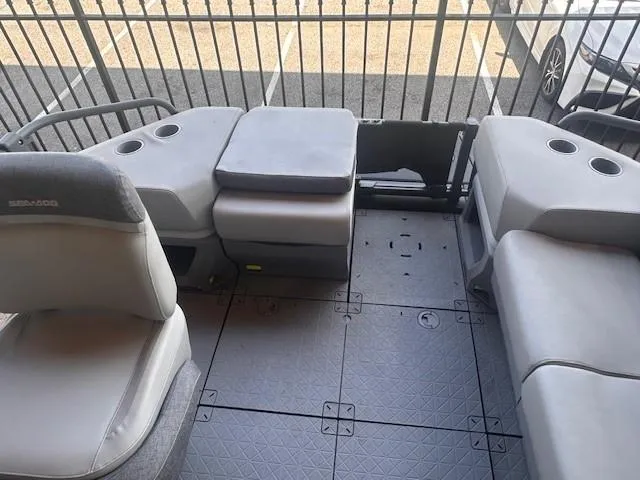 Slide: The Image of 2023 Sea-Doo Sport Boats 18 Switch Sport interior with gray seating and cup holders. - 3