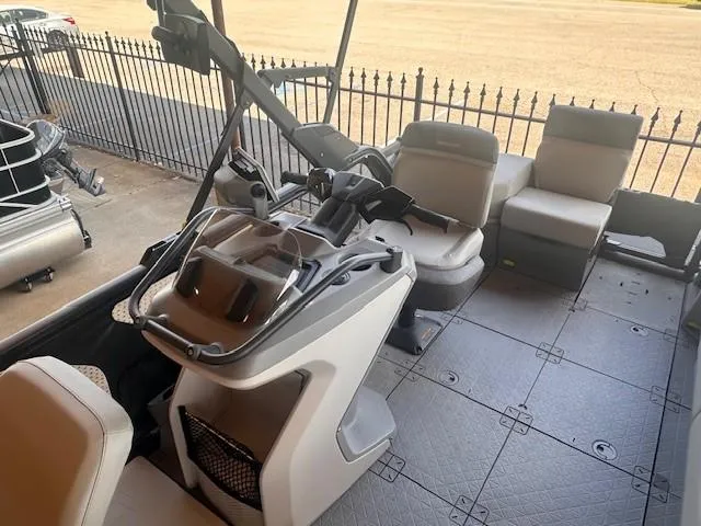 Slide: The Image of 2023 Sea-Doo Sport Boats 18 Switch Sport interior with modern seating and steering console. - 8