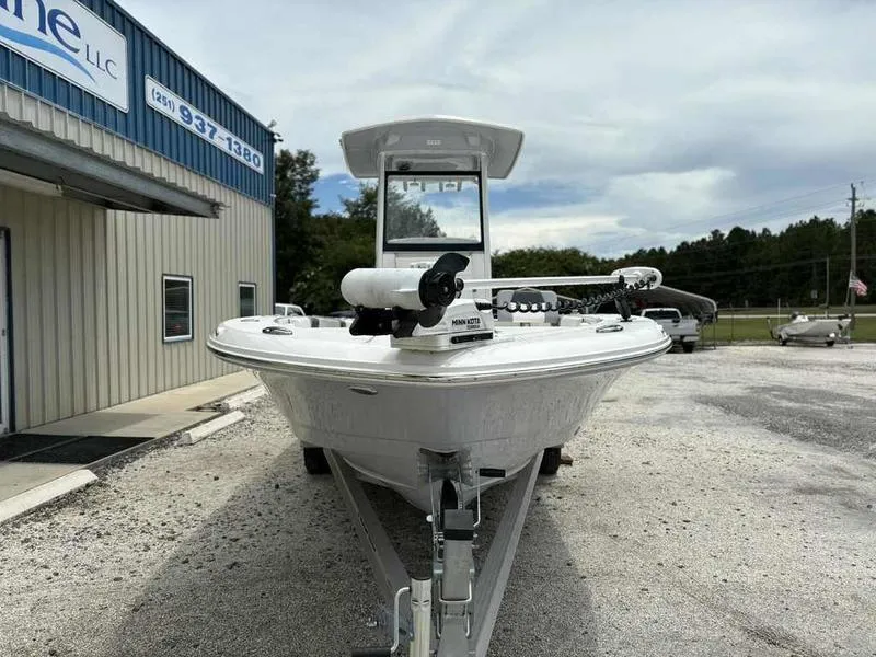Slide: The Image of 2024 Robalo 246 Cayman boat on trailer outside dealership. - 3