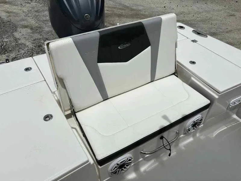 Slide: The Image of 2024 Robalo 246 Cayman boat seat with integrated speakers and sleek design. - 6