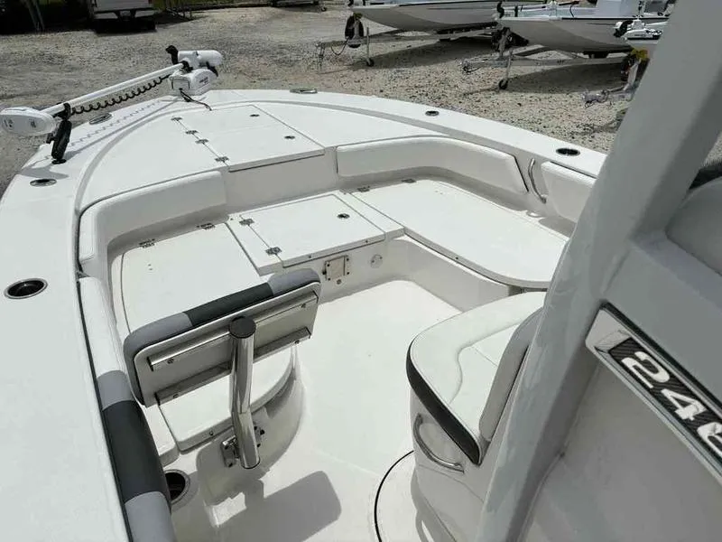 Slide: The Image of 2024 Robalo 246 Cayman boat interior with seating and storage compartments. - 8