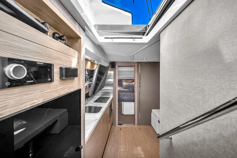 Slide: The Image of Interior of 2020 Azimut Verve 40 yacht, featuring modern kitchen and sleek design. - 23