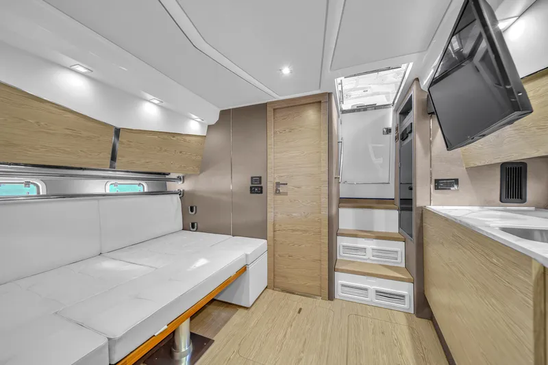 Slide: The Image of Interior of 2020 Azimut Verve 40 yacht with modern design and white seating. - 25