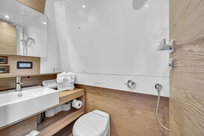Slide: The Image of Modern bathroom in 2020 Azimut Verve 40 yacht with sleek fixtures and wooden accents. - 33