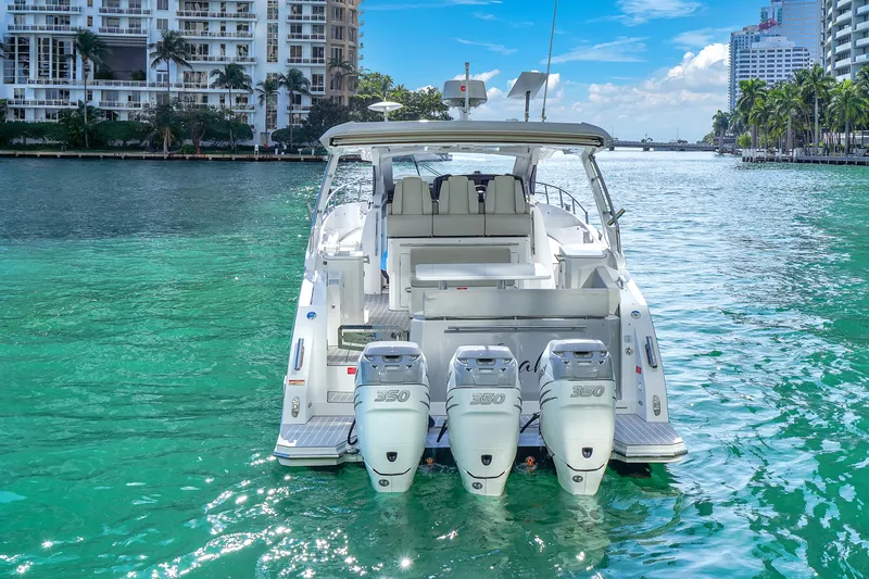 Slide: The Image of Azimut Verve 40 yacht, 2020 model, cruising in turquoise waters near urban skyline. - 5