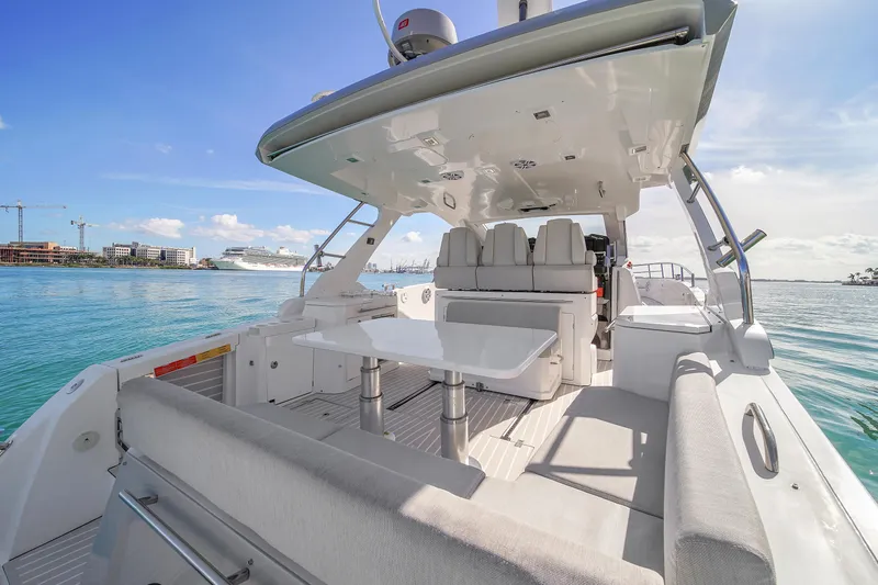 Slide: The Image of Azimut Verve 40 yacht interior, 2020 model, featuring sleek seating and table on open water. - 9