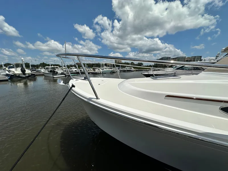 Slide: The Image of 2022 Back Cove 34O yacht docked at marina under blue sky. - 12