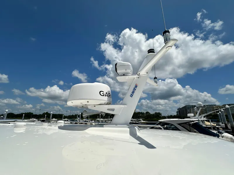 Slide: The Image of 2022 Back Cove 34O yacht with Garmin radar and Seaview mount under a clear blue sky. - 13