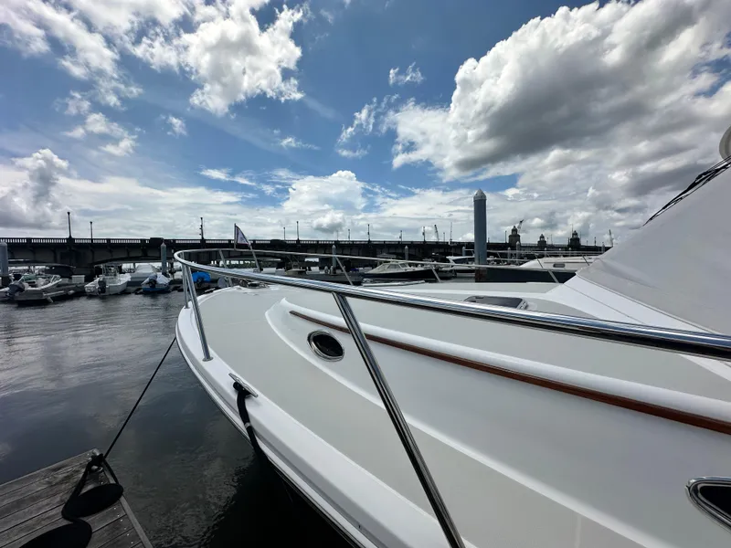 Slide: The Image of 2022 Back Cove 34O yacht docked at marina under partly cloudy sky. - 15