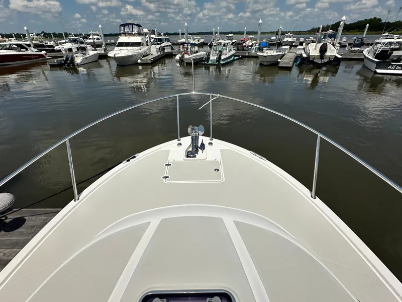 Slide: The Image of Bow view of 2022 Back Cove 34O yacht docked at marina. - 18