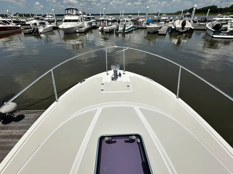 Slide: The Image of Bow view of 2022 Back Cove 34O yacht docked at marina. - 19