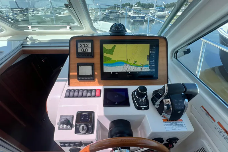 Slide: The Image of Helm of 2022 Back Cove 34O with navigation and control systems. - 30