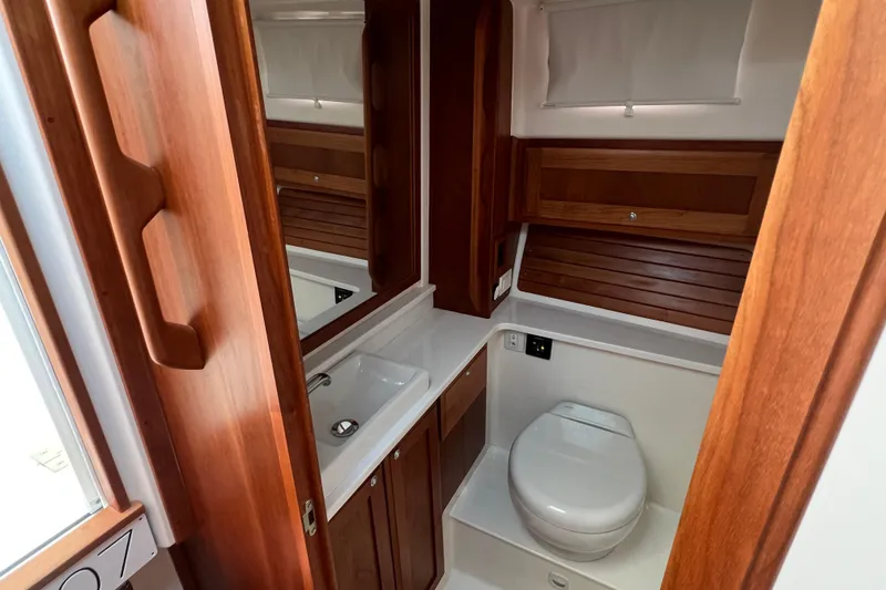 Slide: The Image of Luxurious bathroom in 2022 Back Cove 34O yacht with wooden cabinetry and modern fixtures. - 37