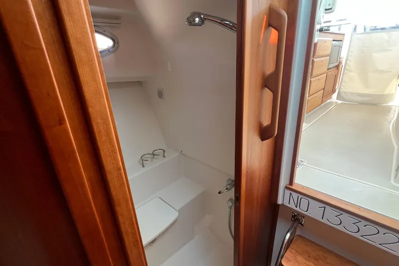 Slide: The Image of 2022 Back Cove 34O yacht interior showing bathroom and cabin area. - 38